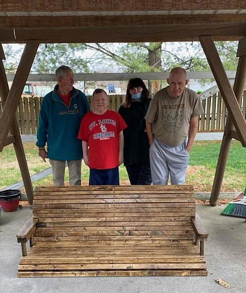 CILA residents receive hand-crafted bench from HS students